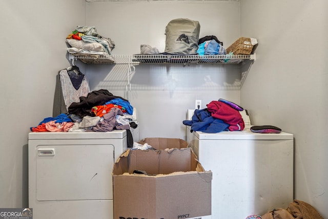 washroom featuring laundry area and washer and clothes dryer