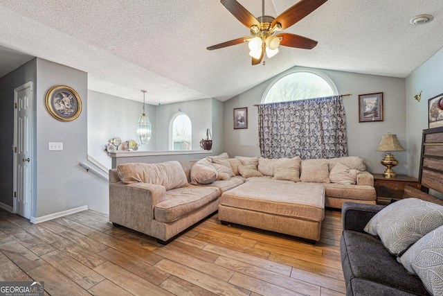 living room featuring a healthy amount of sunlight and wood finished floors