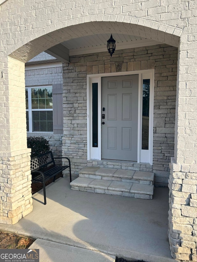 property entrance featuring covered porch