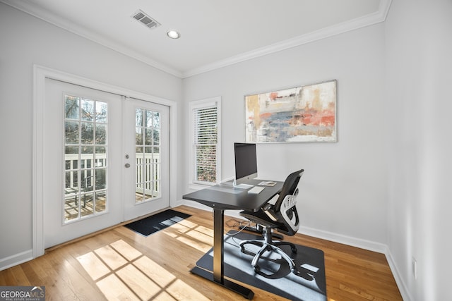 office space with visible vents, baseboards, ornamental molding, french doors, and wood finished floors