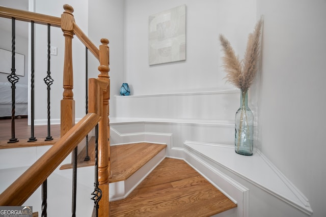 stairway with wood finished floors