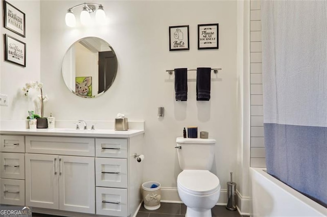 bathroom featuring toilet, shower / tub combo, vanity, tile patterned flooring, and baseboards