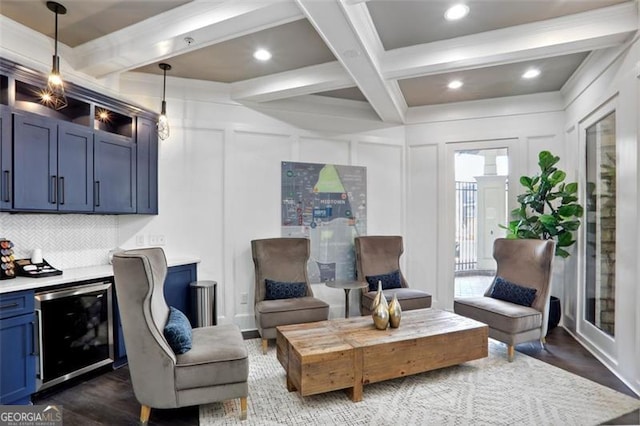 interior space featuring dark wood finished floors, beam ceiling, and a decorative wall