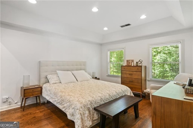 bedroom with visible vents, dark wood finished floors, and recessed lighting