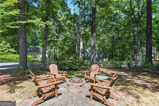 view of patio with an outdoor fire pit