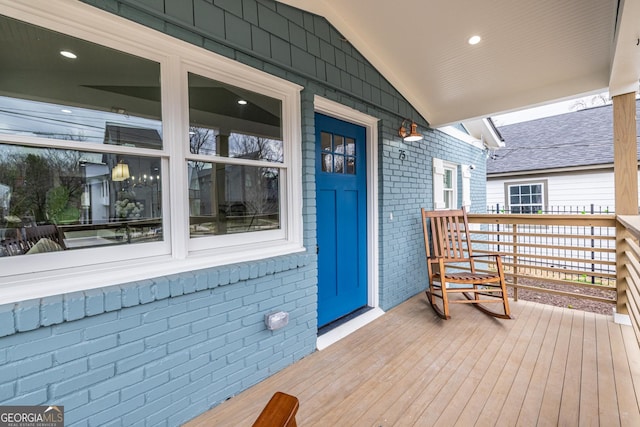 wooden deck featuring covered porch