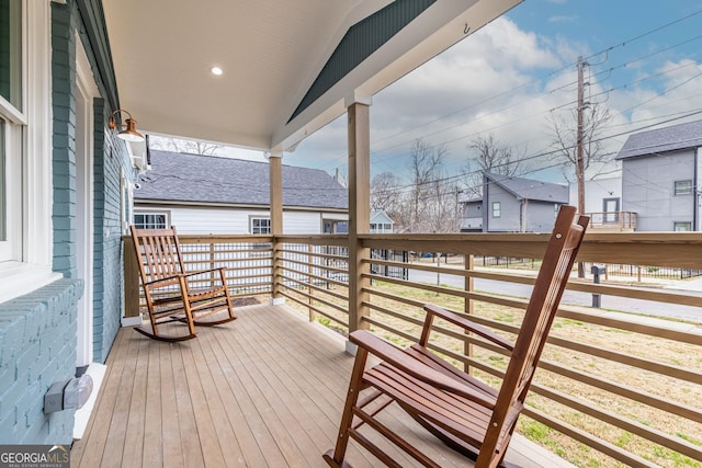 wooden terrace with a residential view