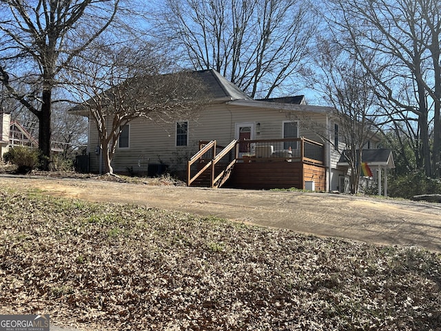 exterior space with driveway and central AC unit