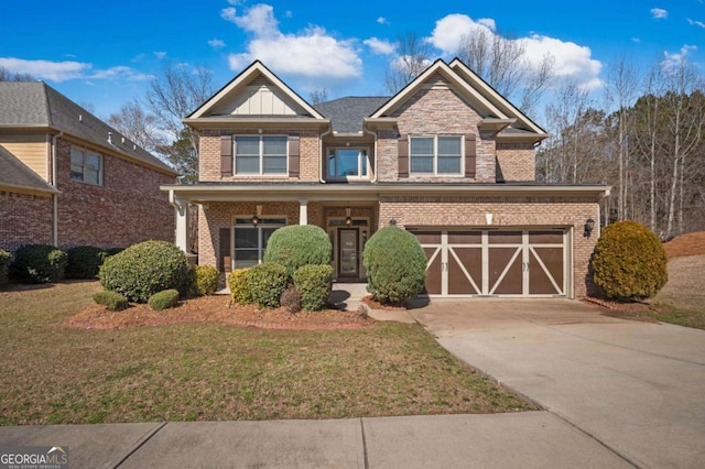 view of front of house featuring concrete driveway, a front lawn, board and batten siding, and brick siding