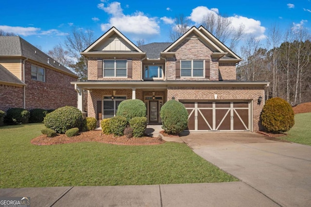 view of front of house featuring concrete driveway, an attached garage, a front yard, board and batten siding, and brick siding