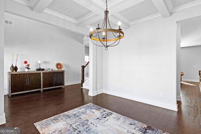 dining room featuring baseboards, visible vents, stairway, wood finished floors, and an inviting chandelier