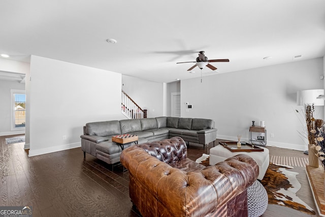 living area with recessed lighting, ceiling fan, wood finished floors, baseboards, and stairs