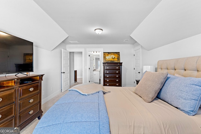 bedroom with light carpet and baseboards