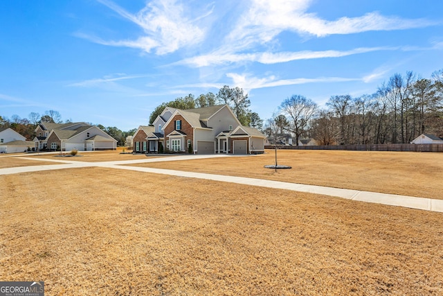 view of yard featuring a garage and fence