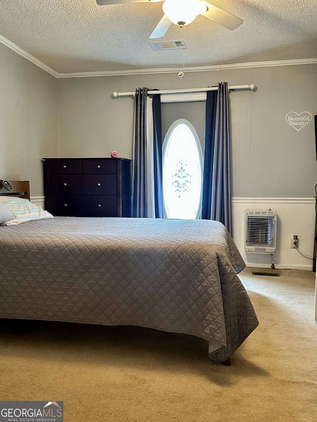 carpeted bedroom featuring a ceiling fan, an AC wall unit, crown molding, and a textured ceiling