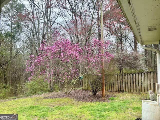 view of yard featuring fence