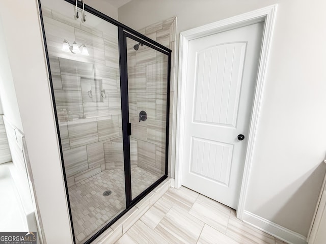 bathroom with a shower stall