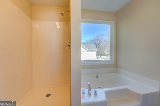 full bath featuring a tile shower and a whirlpool tub