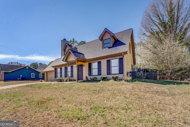 view of front of property with a garage, a shingled roof, fence, cooling unit, and a front lawn