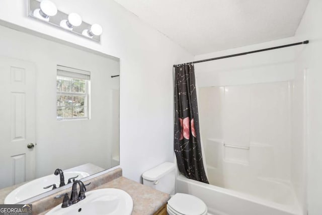 bathroom with shower / tub combo, vanity, and toilet