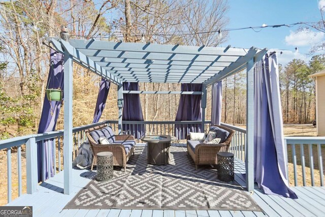 wooden terrace featuring a pergola and an outdoor hangout area