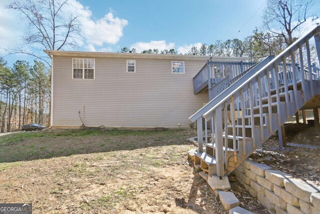 view of property exterior featuring stairway