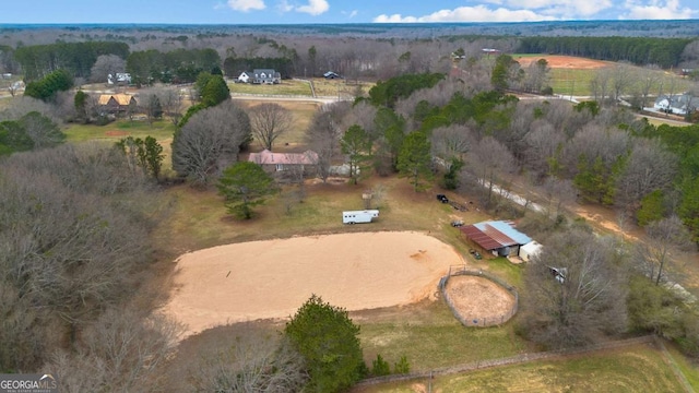 birds eye view of property with a rural view