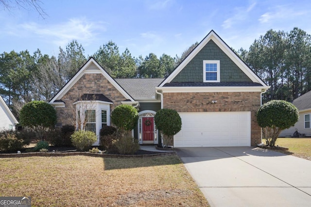 view of front of home featuring driveway, a front lawn, and brick siding