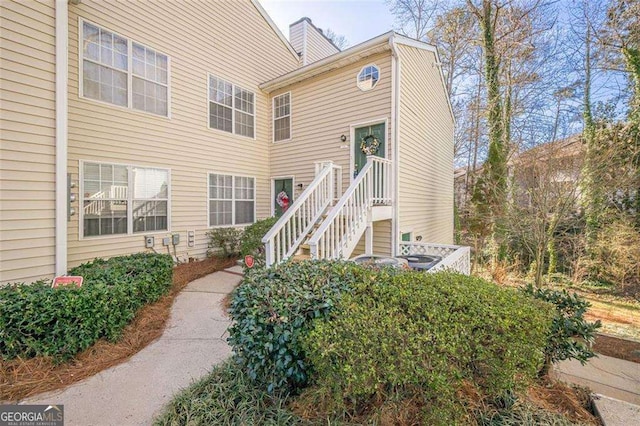 property entrance with a chimney