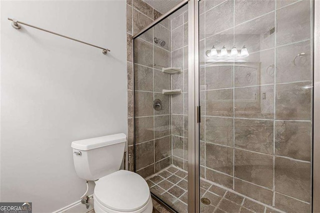 full bath with a stall shower and toilet