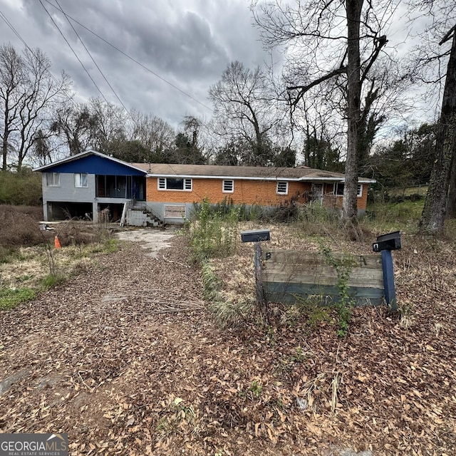 view of front of property featuring brick siding