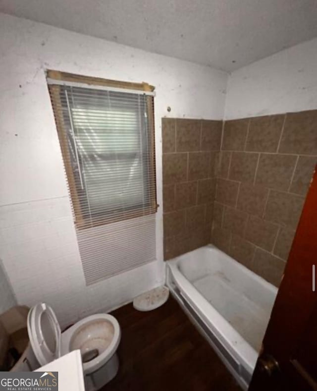 1188 Sunnydale Dr, Macon, GA 31217 - full bathroom featuring a shower, toilet, and wood finished floors