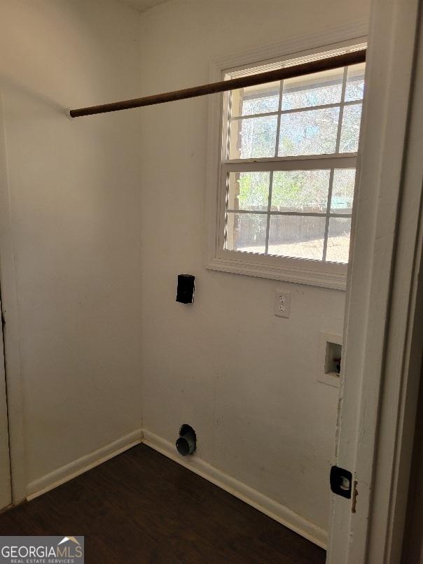 washroom with laundry area, dark wood-type flooring, hookup for a washing machine, and baseboards