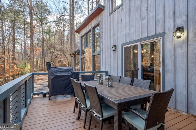 wooden terrace with outdoor dining space