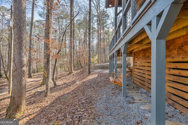 view of yard featuring an outbuilding and an exterior structure