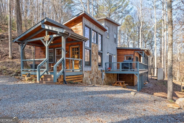 chalet / cabin with covered porch