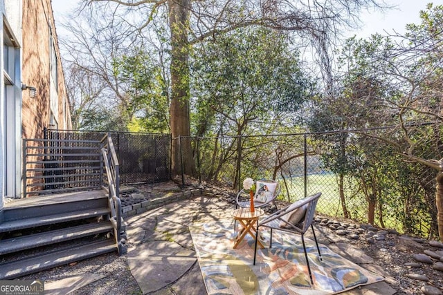 view of patio / terrace featuring fence