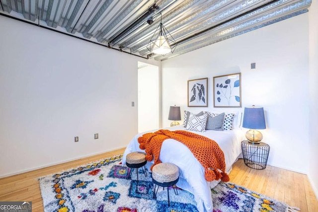 bedroom featuring wood finished floors