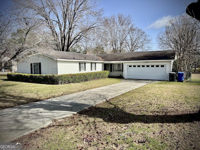 ranch-style house with a garage, driveway, and a front lawn