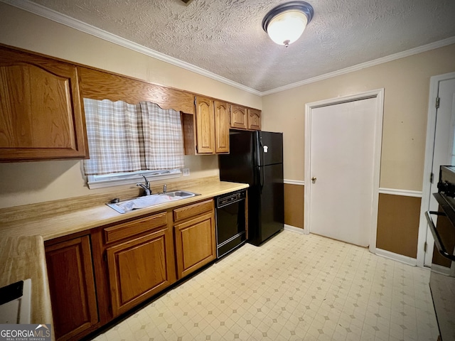 kitchen with light floors, light countertops, a sink, and black appliances