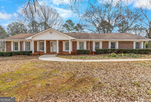 view of front of home featuring brick siding