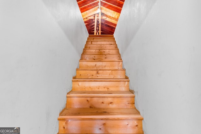 stairs with lofted ceiling