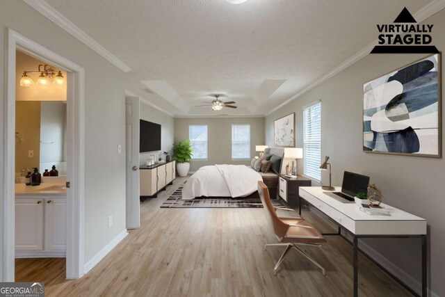 bedroom featuring ensuite bathroom, ornamental molding, light wood-style flooring, and baseboards