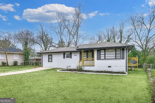 view of front of home featuring a front yard, crawl space, covered porch, and fence