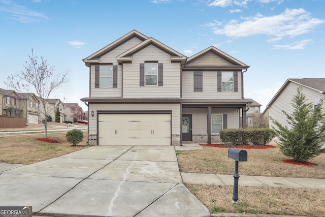 craftsman-style home featuring a garage, driveway, and brick siding