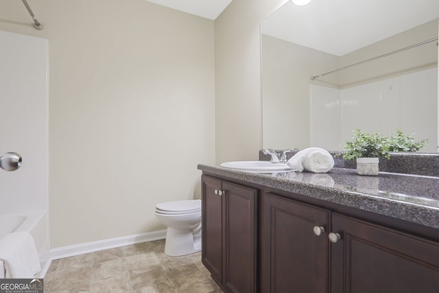 full bathroom featuring toilet, shower / bathtub combination, baseboards, and vanity