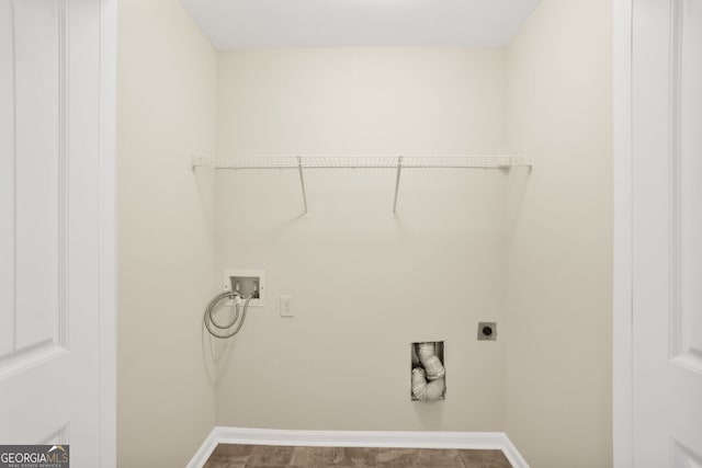 washroom featuring baseboards, laundry area, washer hookup, and hookup for an electric dryer