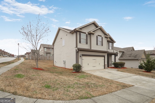 view of front of property featuring a garage, concrete driveway, fence, and a front lawn