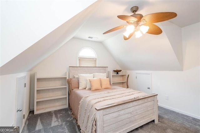 carpeted bedroom with visible vents, vaulted ceiling, baseboards, and ceiling fan