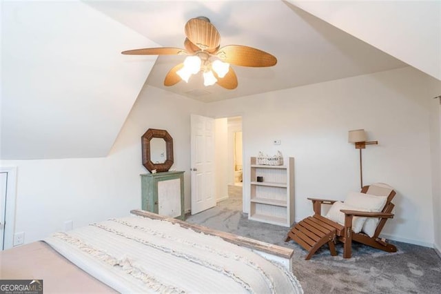 carpeted bedroom featuring ceiling fan and vaulted ceiling